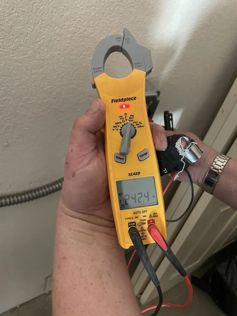 Voltage testing with clamp meter during Generator Installation in Fort Myers